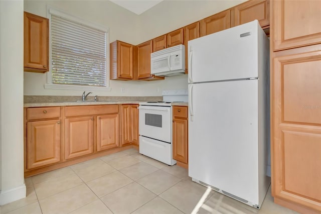 18139 Great Blue Heron Dr, Groveland, FL 34736 - kitchen with white appliances, light countertops, and light tile patterned flooring