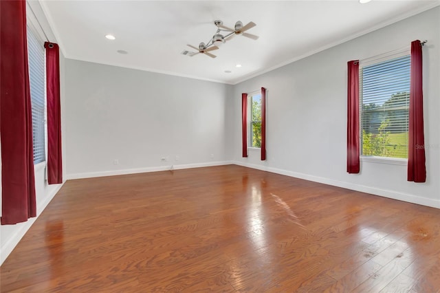 18139 Great Blue Heron Dr, Groveland, FL 34736 - empty room featuring crown molding, wood finished floors, and recessed lighting