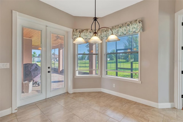 18139 Great Blue Heron Dr, Groveland, FL 34736 - unfurnished dining area with french doors and light tile patterned flooring