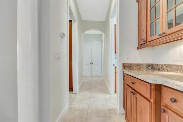 18139 Great Blue Heron Dr, Groveland, FL 34736 - corridor with arched walkways and light tile patterned floors