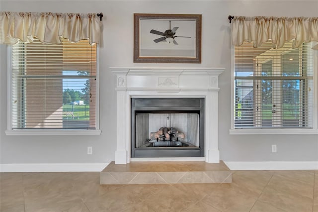 18139 Great Blue Heron Dr, Groveland, FL 34736 - detailed view of a fireplace with raised hearth and ceiling fan