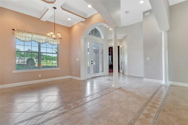 18139 Great Blue Heron Dr, Groveland, FL 34736 - foyer with inlaid floor details, coffered ceiling, beam ceiling, light tile patterned floors, and ornate columns