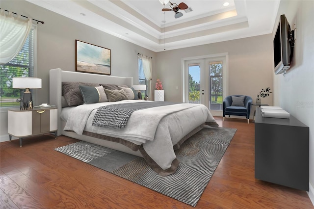 18139 Great Blue Heron Dr, Groveland, FL 34736 - bedroom with a raised ceiling, access to exterior, wood finished floors, ornamental molding, and recessed lighting