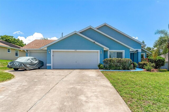 1412 Cove Pl, Tavares, FL 32778 - ranch-style home featuring a garage, a front yard, concrete driveway, and stucco siding