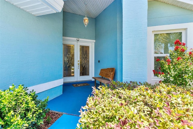 1412 Cove Pl, Tavares, FL 32778 - doorway to property with french doors and stucco siding