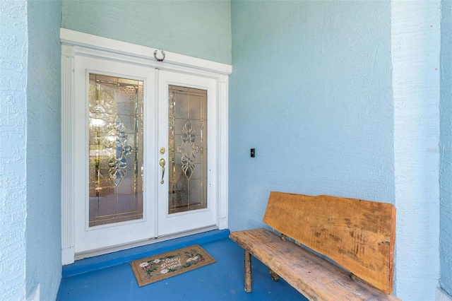 1412 Cove Pl, Tavares, FL 32778 - doorway to property with french doors and stucco siding