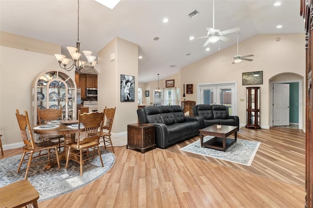 1412 Cove Pl, Tavares, FL 32778 - dining room featuring light wood-type flooring, arched walkways, ceiling fan, high vaulted ceiling, and recessed lighting
