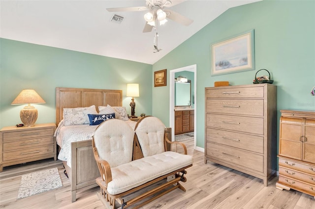 1412 Cove Pl, Tavares, FL 32778 - bedroom with vaulted ceiling, light wood-style floors, connected bathroom, and a ceiling fan