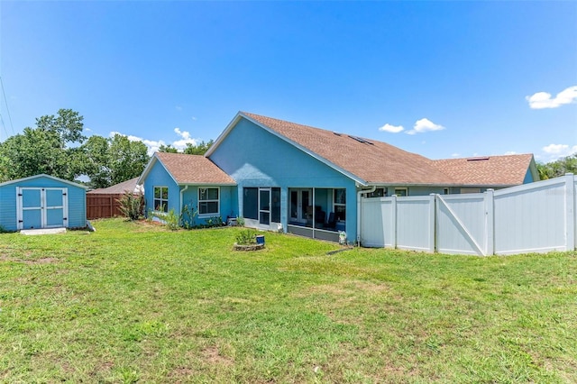 1412 Cove Pl, Tavares, FL 32778 - rear view of property with a fenced backyard, a storage shed, a sunroom, and roof with shingles