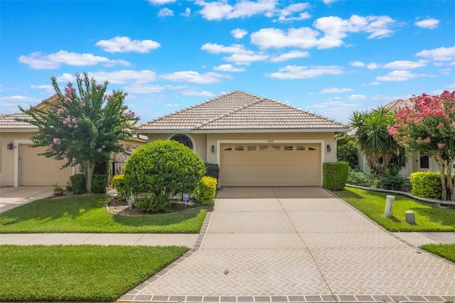 9015 Saint Andrews Way, Mount Dora, FL 32757 - ranch-style house featuring stucco siding, an attached garage, concrete driveway, and a tile roof