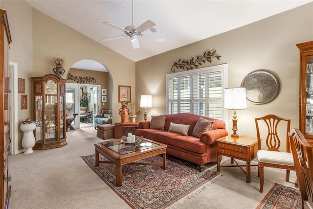 9015 Saint Andrews Way, Mount Dora, FL 32757 - carpeted living area featuring arched walkways, a ceiling fan, healthy amount of natural light, and high vaulted ceiling