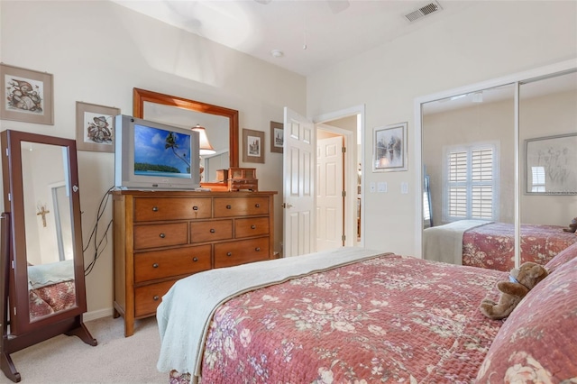 9015 Saint Andrews Way, Mount Dora, FL 32757 - bedroom with light colored carpet, ceiling fan, and a closet