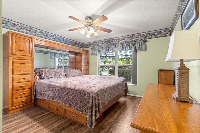 89 Palermo Pl, The Villages, FL 32159 - bedroom featuring dark wood-style floors, a textured ceiling, and ceiling fan