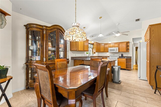 89 Palermo Pl, The Villages, FL 32159 - dining room featuring vaulted ceiling, ceiling fan, and light tile patterned floors