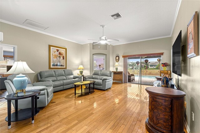 89 Palermo Pl, The Villages, FL 32159 - living room with light wood finished floors, crown molding, and a ceiling fan