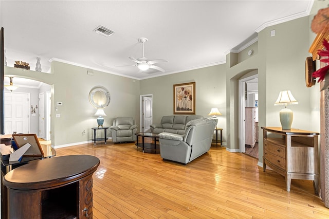 89 Palermo Pl, The Villages, FL 32159 - living room featuring ceiling fan, arched walkways, crown molding, and light wood finished floors