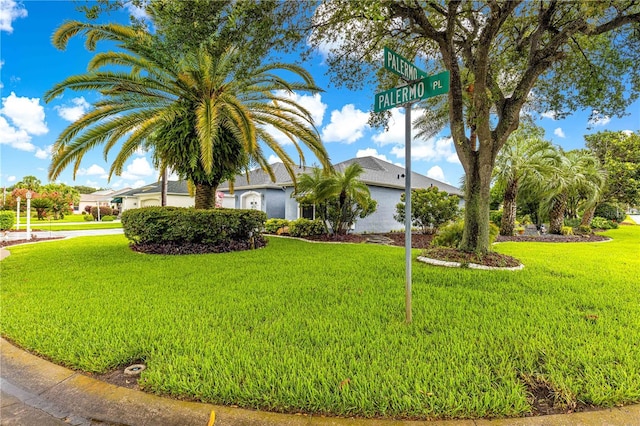 89 Palermo Pl, The Villages, FL 32159 - view of front of house featuring a front yard and stucco siding