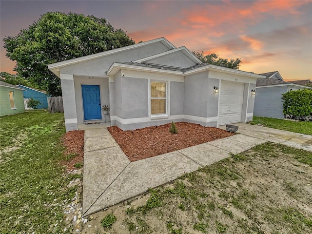 7047 Hickory Branch Cir, Orlando, FL 32818 - view of front of home with an attached garage and stucco siding