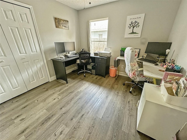 7047 Hickory Branch Cir, Orlando, FL 32818 - home office with wood finished floors and a textured ceiling