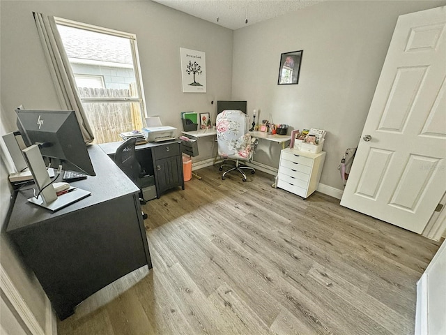 7047 Hickory Branch Cir, Orlando, FL 32818 - office with light wood-style flooring and a textured ceiling