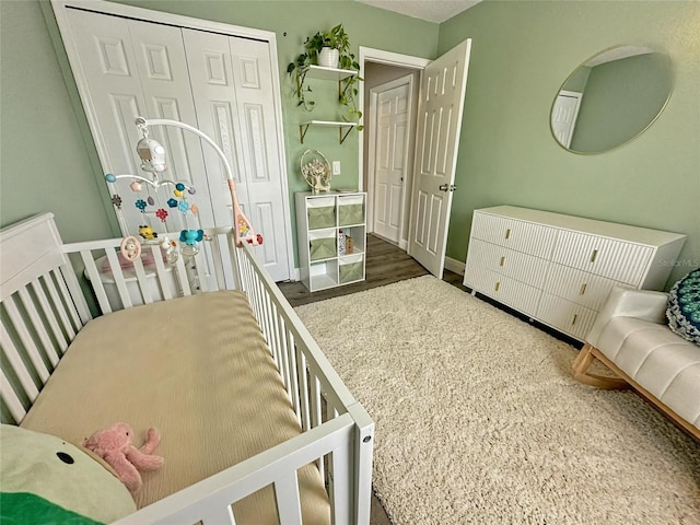 7047 Hickory Branch Cir, Orlando, FL 32818 - bedroom with a closet and wood finished floors