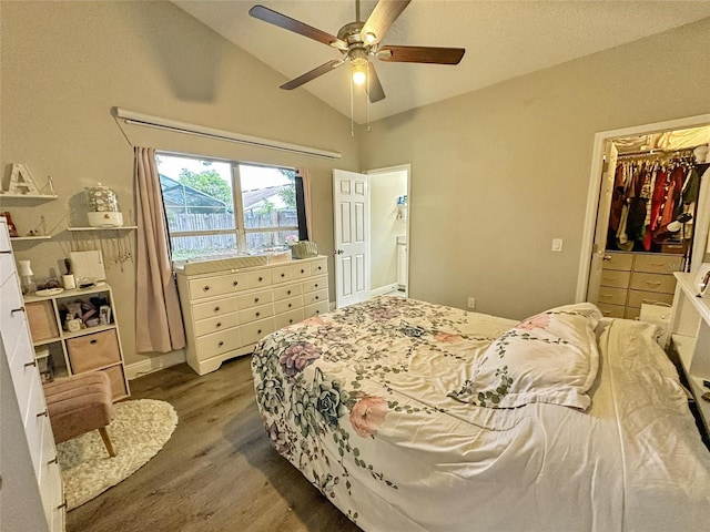 7047 Hickory Branch Cir, Orlando, FL 32818 - bedroom with dark wood-style flooring, lofted ceiling, and a ceiling fan