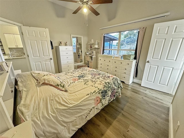 7047 Hickory Branch Cir, Orlando, FL 32818 - bedroom featuring wood finished floors, lofted ceiling, and a ceiling fan