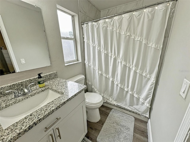 7047 Hickory Branch Cir, Orlando, FL 32818 - bathroom with vanity, wood finished floors, and a shower with shower curtain