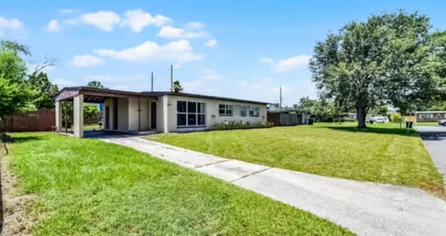 5912 Navajo Way, Orlando, FL 32807 - view of front facade featuring a carport and driveway
