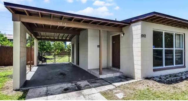 5912 Navajo Way, Orlando, FL 32807 - view of vehicle parking with a carport