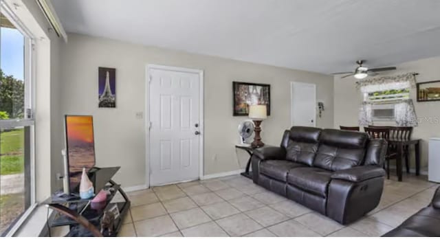 5912 Navajo Way, Orlando, FL 32807 - living area with light tile patterned floors and a ceiling fan