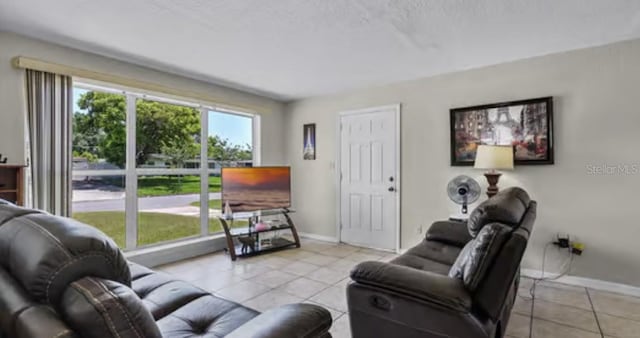 5912 Navajo Way, Orlando, FL 32807 - living area featuring light tile patterned flooring