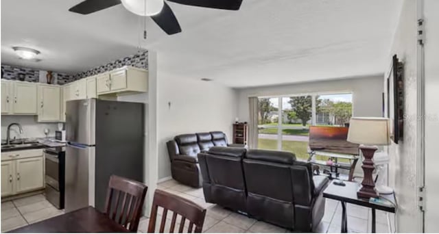 5912 Navajo Way, Orlando, FL 32807 - living room with a ceiling fan and light tile patterned flooring