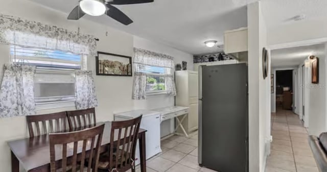 5912 Navajo Way, Orlando, FL 32807 - kitchen featuring freestanding refrigerator, light tile patterned floors, ceiling fan, and light countertops