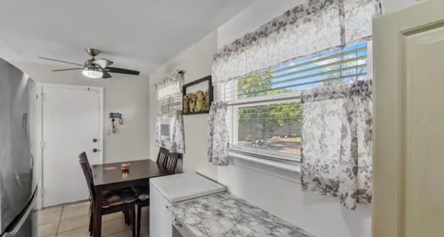 5912 Navajo Way, Orlando, FL 32807 - dining area featuring a ceiling fan and light tile patterned floors