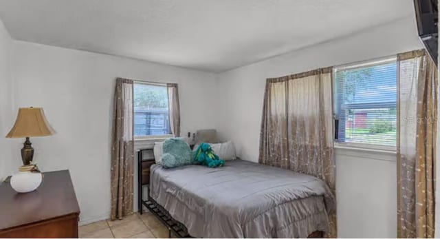5912 Navajo Way, Orlando, FL 32807 - bedroom with light tile patterned floors