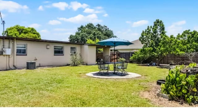 5912 Navajo Way, Orlando, FL 32807 - rear view of house with stucco siding and a patio area