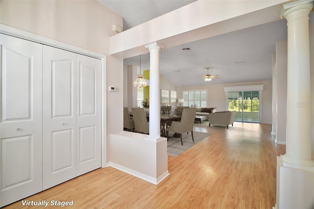 182 Palermo Pl, Lady Lake, FL 32159 - hall with decorative columns, light wood-style flooring, and lofted ceiling