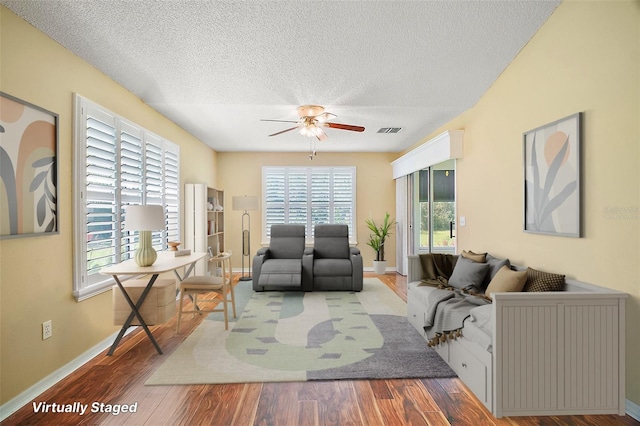 182 Palermo Pl, Lady Lake, FL 32159 - living area featuring ceiling fan, a textured ceiling, and wood finished floors
