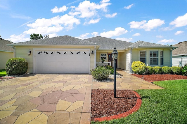 182 Palermo Pl, Lady Lake, FL 32159 - ranch-style house with driveway, a garage, and a front yard