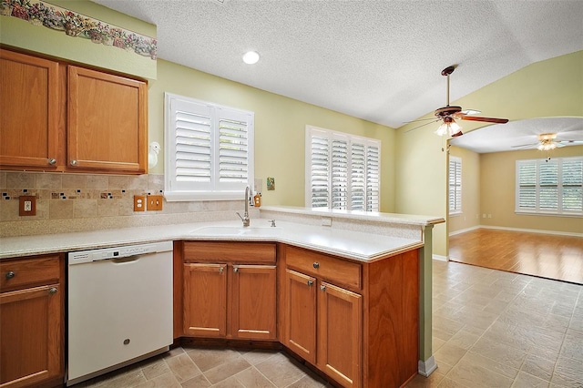 182 Palermo Pl, Lady Lake, FL 32159 - kitchen featuring dishwasher, a ceiling fan, a peninsula, open floor plan, and light countertops