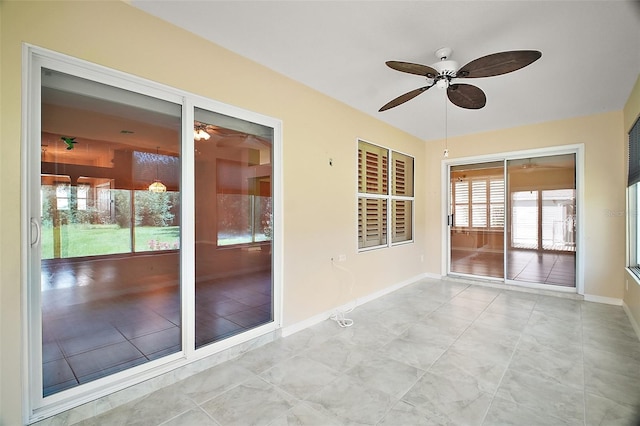 182 Palermo Pl, Lady Lake, FL 32159 - unfurnished sunroom with ceiling fan and tile patterned floors