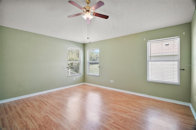 182 Palermo Pl, Lady Lake, FL 32159 - unfurnished room featuring a ceiling fan, a textured ceiling, and wood finished floors