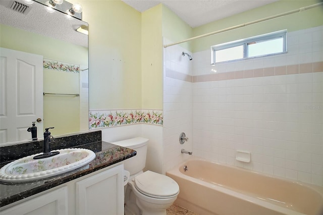 182 Palermo Pl, Lady Lake, FL 32159 - bathroom featuring vanity, shower / bath combination, a wainscoted wall, and a textured ceiling