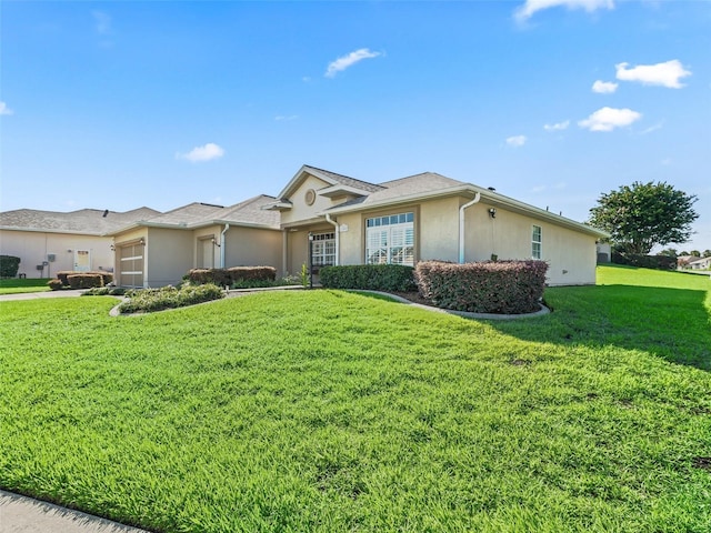 11092 SE 174th Loop, Summerfield, FL 34491 - single story home with an attached garage, stucco siding, and a front lawn