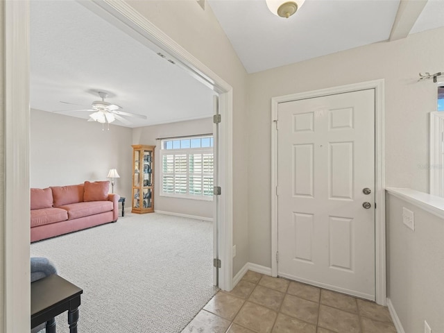 11092 SE 174th Loop, Summerfield, FL 34491 - foyer featuring ceiling fan, light tile patterned flooring, and light colored carpet