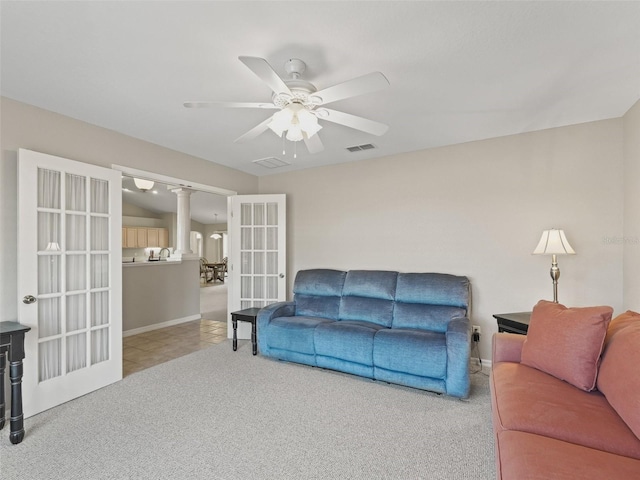 11092 SE 174th Loop, Summerfield, FL 34491 - living area with ceiling fan, french doors, carpet flooring, and ornate columns