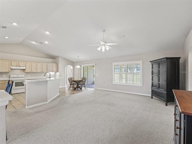 11092 SE 174th Loop, Summerfield, FL 34491 - kitchen featuring white electric range oven, lofted ceiling, light carpet, a ceiling fan, and open floor plan