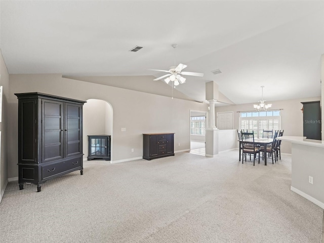 11092 SE 174th Loop, Summerfield, FL 34491 - living area featuring ornate columns, light colored carpet, a ceiling fan, vaulted ceiling, and arched walkways