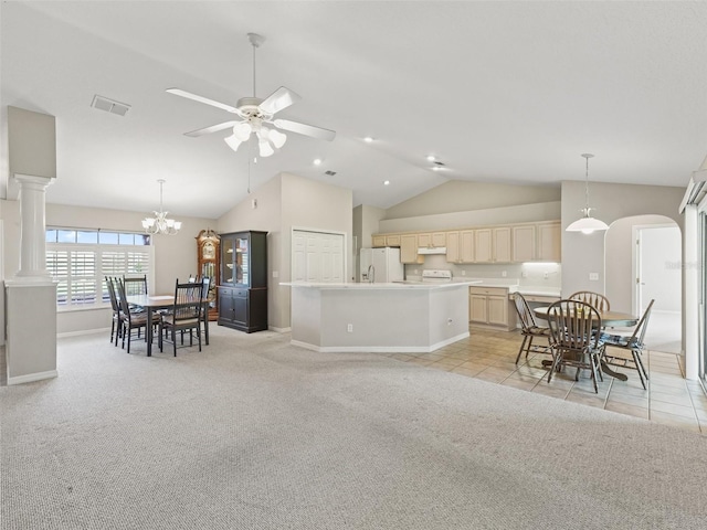 11092 SE 174th Loop, Summerfield, FL 34491 - kitchen with lofted ceiling, light colored carpet, under cabinet range hood, ceiling fan, and a center island